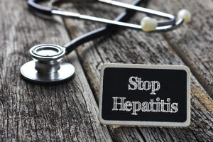 Medical Concept- Stop Hepatitis word written on blackboard with