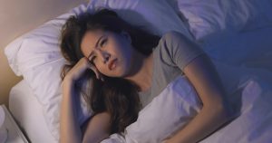 woman having difficulty sleeping 