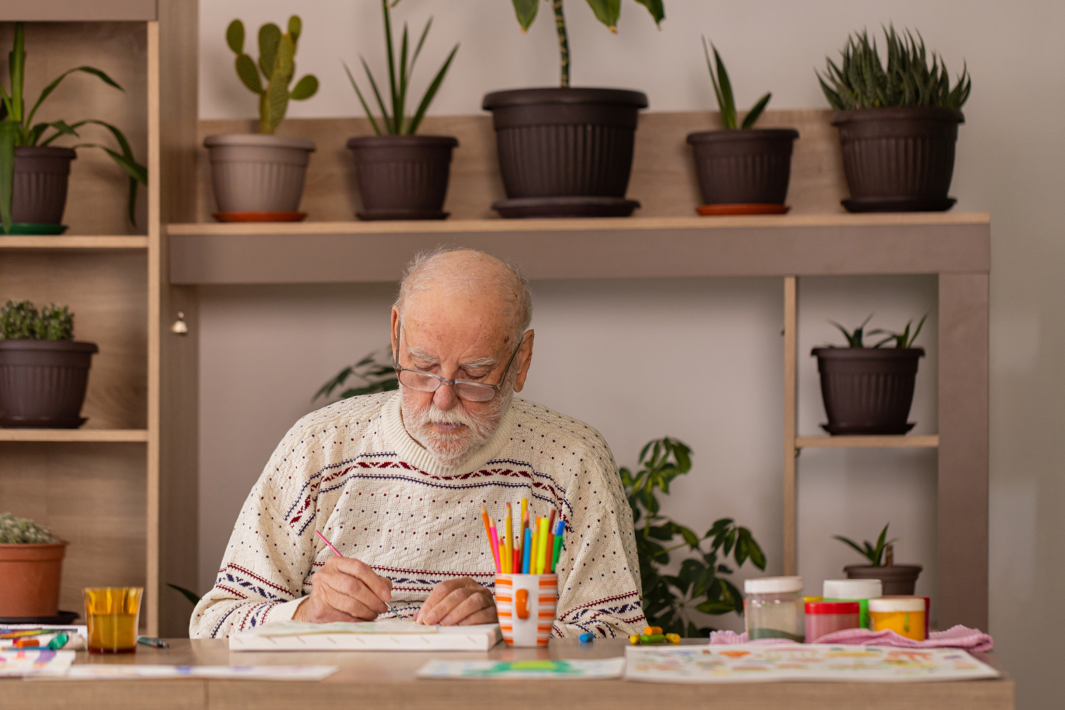 Losing language, gaining creativity Dementia artist painting a picture in the studio